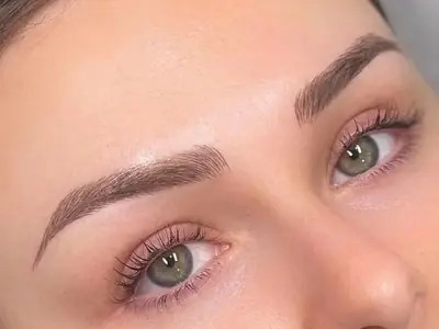 Illustrative close-up of shaped, shaded eyebrows, for an article about permanent makeup