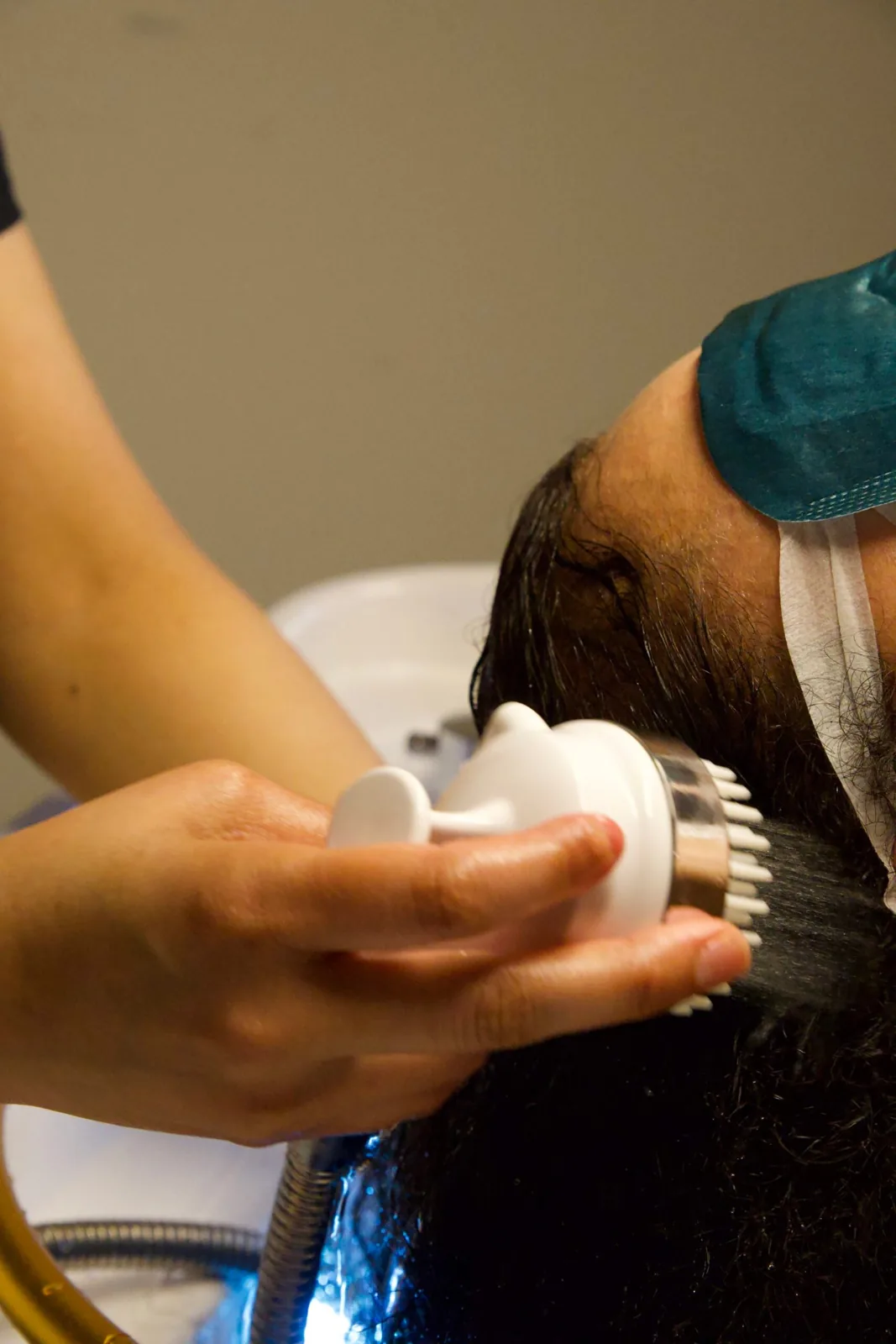 Closeup of a Japanese head spa massage device treating the scalp