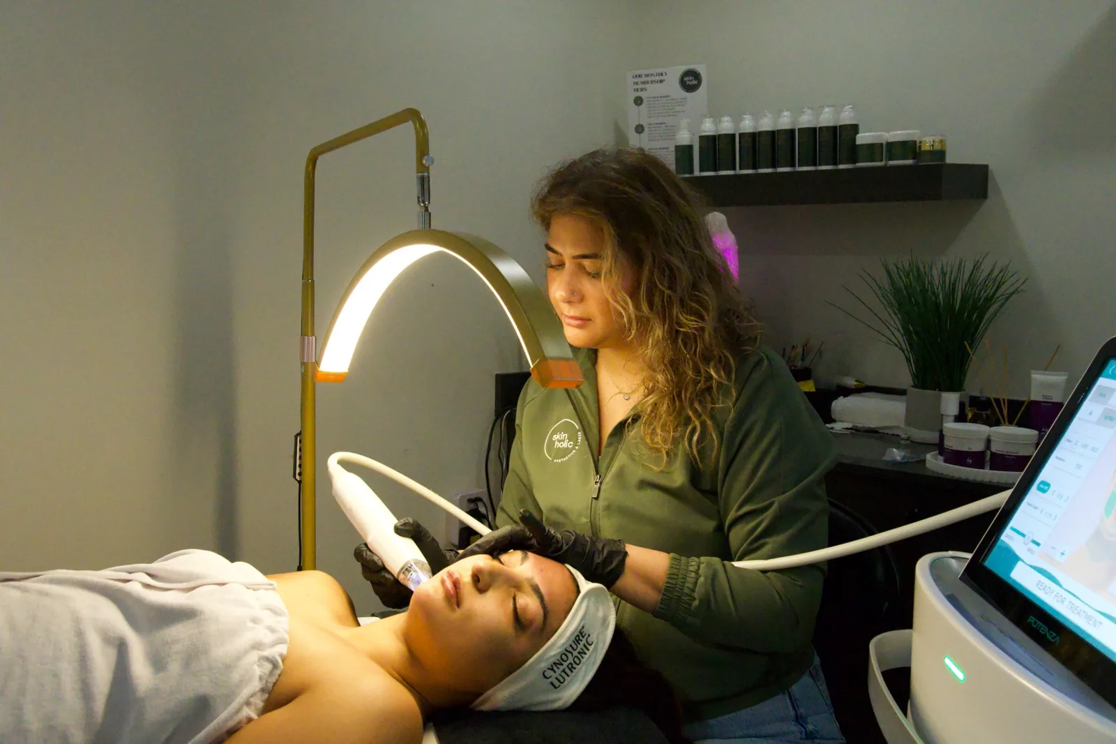 Scar relaxation treatment room with practitioner performing body treatment
